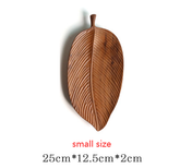 Wooden saucer fruit tray by WoodyKitchenware with a natural wood grain finish, perfect for elegant dining and serving fruit.