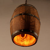 Rustic wooden wine barrel chandelier with vintage design, hanging in a cozy dining or living space, featuring exposed bulbs.