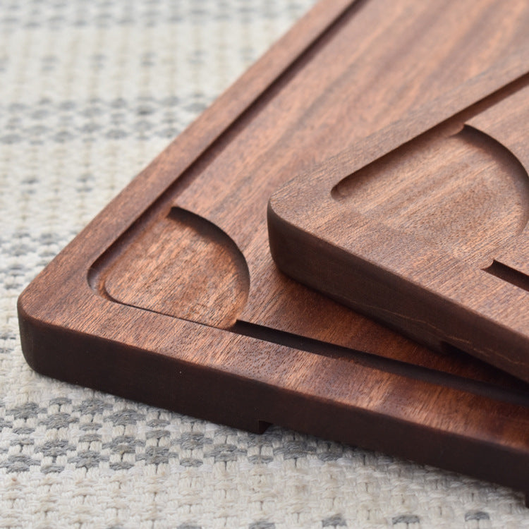 Rustic wooden steak and pizza board by WoodyKitchenware with sauce trough, perfect for serving meats and pizzas in a versatile dining setting.