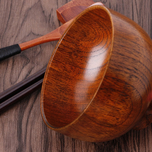 Set of four round wooden bowls by WoodyKitchenware, showcasing natural wood grain and smooth finish for table use.
