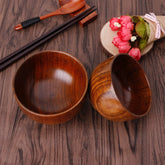 Set of four round wooden bowls from WoodyKitchenware, showcasing natural wood grain and smooth finish for stylish table use.