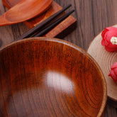 Set of four round wooden bowls by WoodyKitchenware, showcasing natural wood grain and smooth finish for tableware.