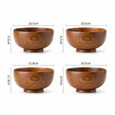 Set of four round wooden bowls by WoodyKitchenware, showcasing natural wood grain and smooth finish for table decor and serving.