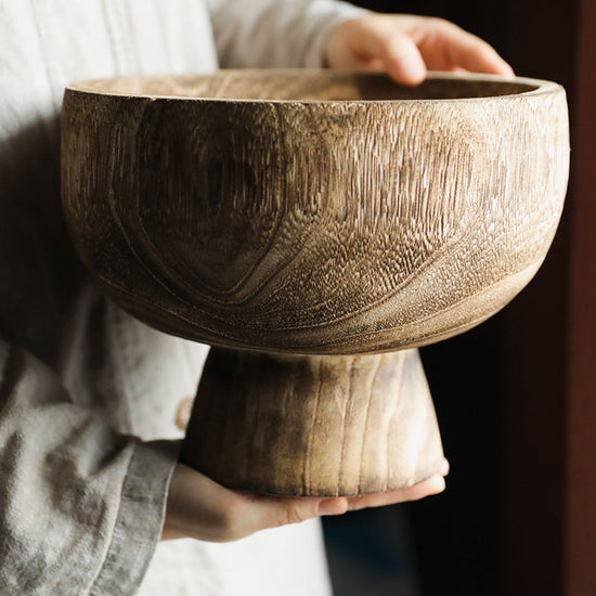 Decorative wooden bowl by WoodyKitchenware featuring a pedestal design and natural wood finish, perfect for home decor.