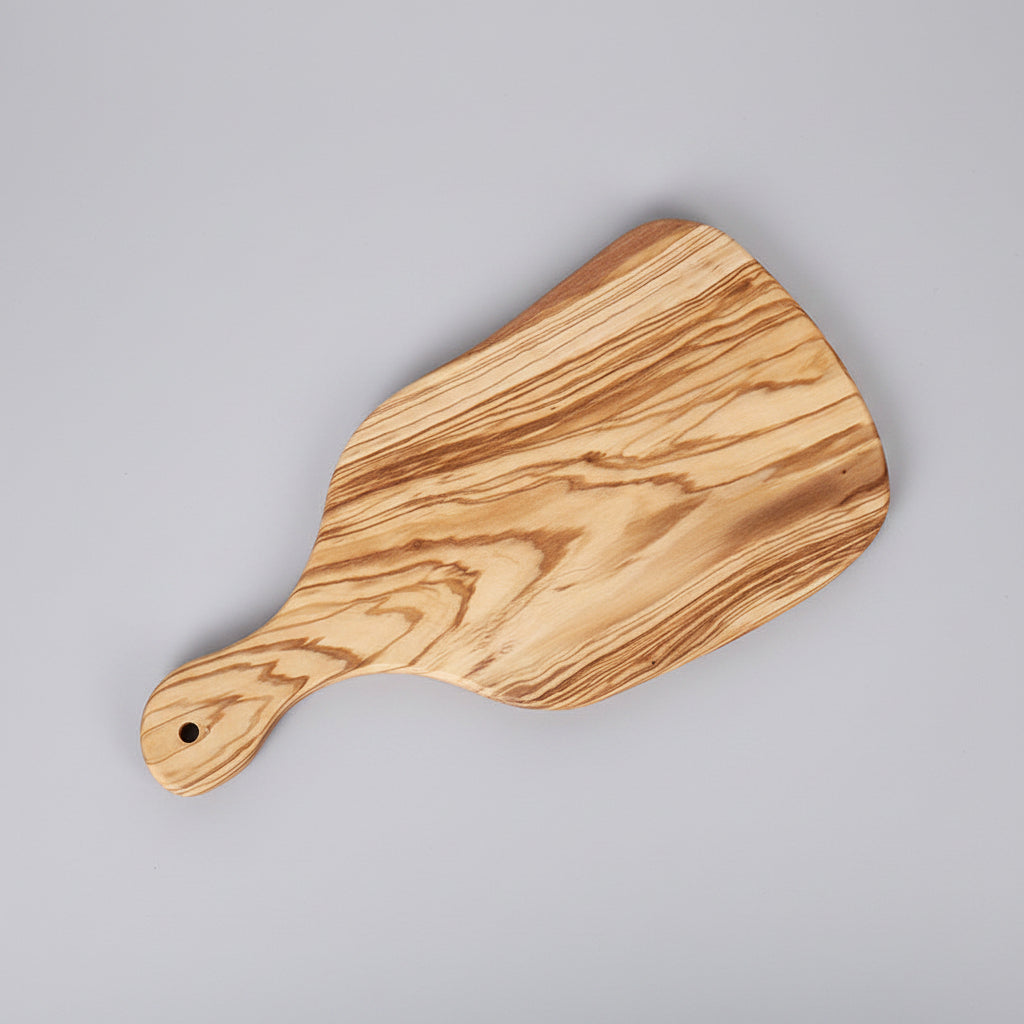 Olive wood cutting board from WoodyKitchenware, showcasing natural grain and smooth surface, ideal for kitchen prep and serving.