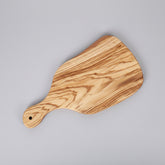 Olive wood cutting board from WoodyKitchenware, showcasing natural grain and smooth surface, ideal for kitchen prep and serving.
