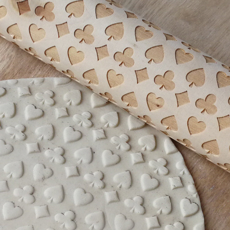 Wooden Christmas poker printing rolling pin with festive holiday designs, perfect for adding fun to holiday baking.