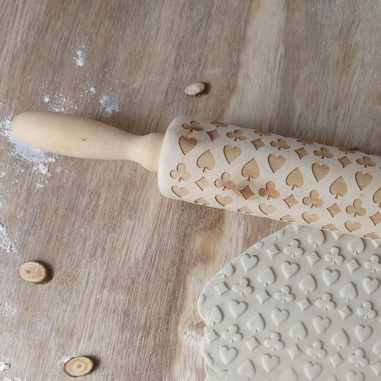 Wooden Christmas poker printing rolling pin with festive holiday designs, perfect for adding seasonal fun to baking.