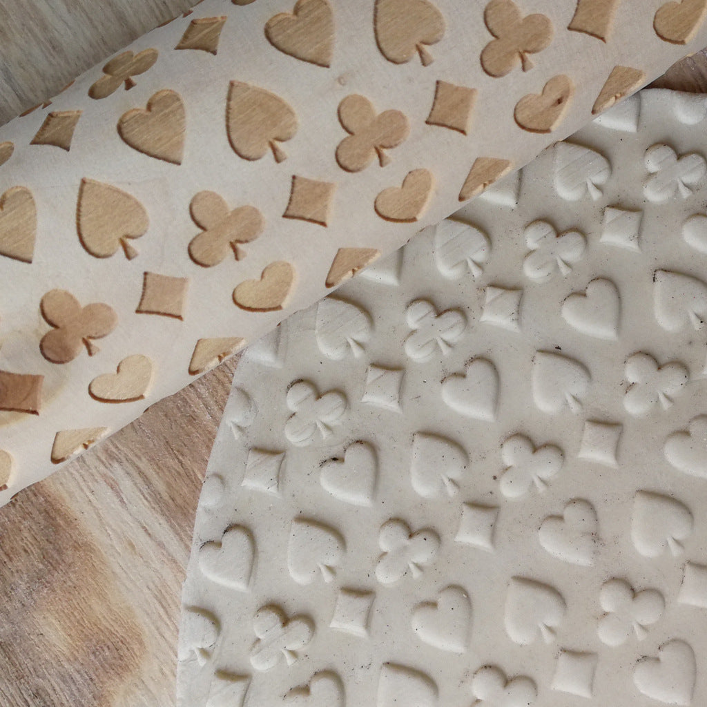 Wooden Christmas poker printing rolling pin from WoodyKitchenware with festive holiday print for baking fun.