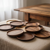 Round wooden plate from WoodyKitchenware with smooth finish, perfect for elevating your dining experience.