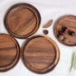 Round wooden plate from WoodyKitchenware featuring a smooth finish, ideal for elevating your dining experience.