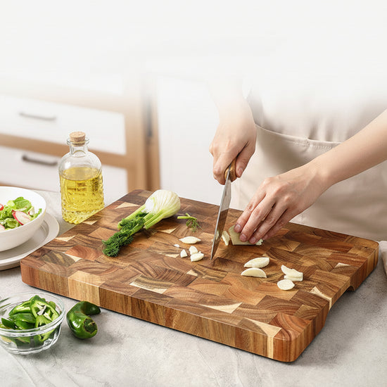 Acacia household solid wood cutting board from WoodyKitchenware, showcasing a smooth, yellow-acacia surface perfect for kitchen prep.