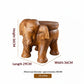 Solid wood elephant side table by WoodyKitchenware featuring a natural finish and detailed carved design.