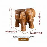 Solid wood elephant side table by WoodyKitchenware featuring carved elephant design, compact and rustic for living room decor.