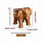 Solid wood elephant side table by WoodyKitchenware featuring carved elephant design, compact and rustic for living room decor.