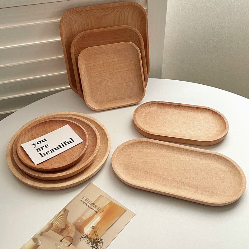 Minimalist round wooden trays from WoodyKitchenware, made of natural wood with smooth, polished surface and minimalist design.