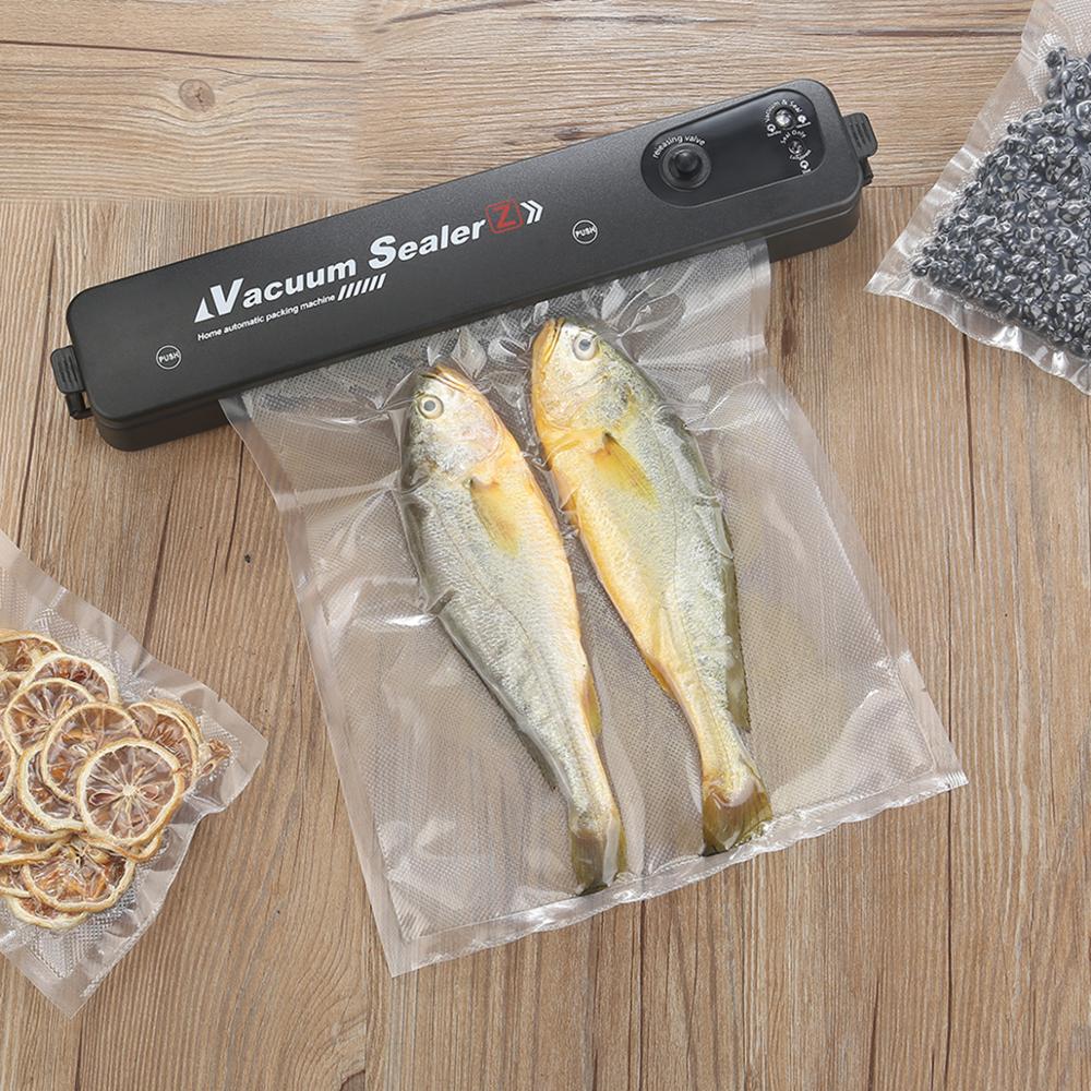 Black WoodyKitchenware Vacuum Sealing Machine by WoodyKitchenware for preserving freshness in food storage.