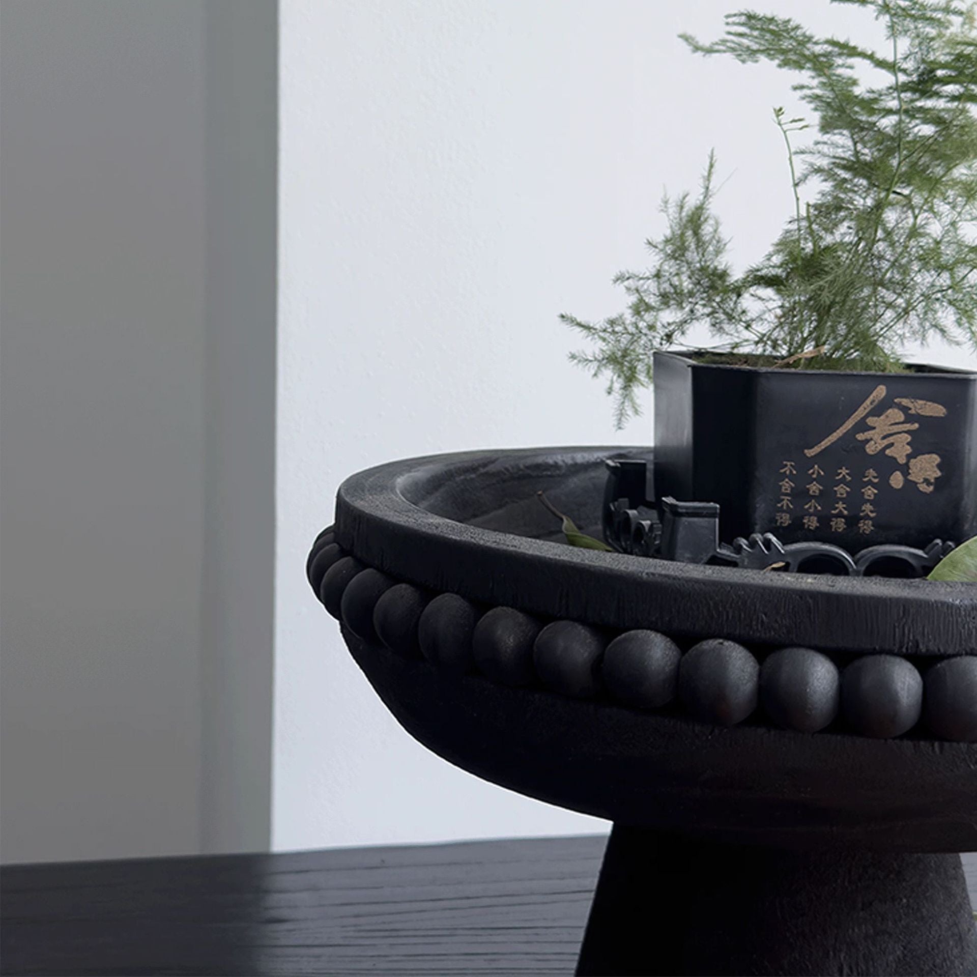 Black solid wood fruit plate in Wabi-Sabi style by WoodyKitchenware, showcasing natural wood grain and minimalist design.