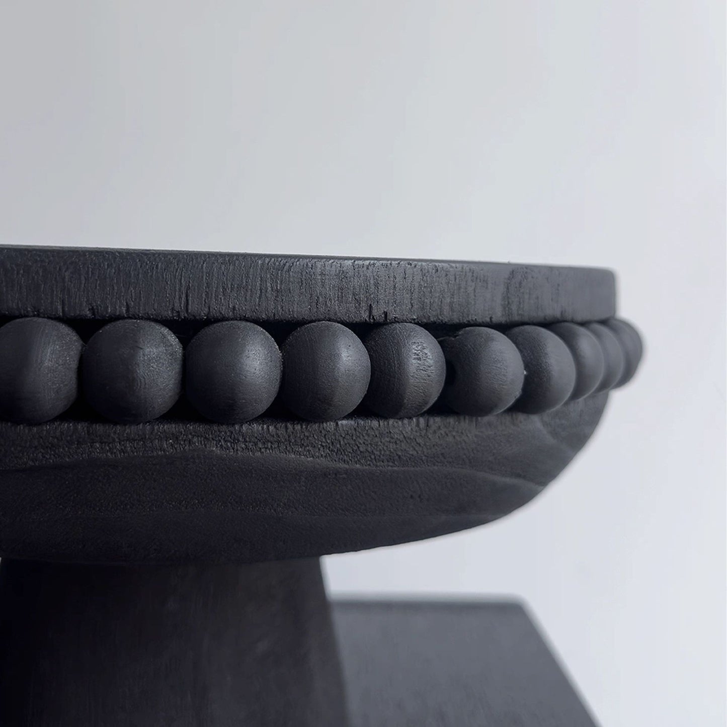 Black solid wood fruit plate in Wabi-Sabi style by WoodyKitchenware, featuring a natural, minimalist design on a rustic wood tray.