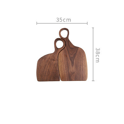 Black walnut cutting board by WoodyKitchenware, elegant and durable with a knife-friendly surface for kitchen prep.