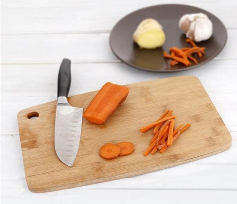 Square bamboo cutting board from WoodyKitchenware, wooden kitchenware with a smooth surface for food prep and chopping.