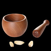 Traditional wooden garlic masher by WoodyKitchenware, Chinese-style kitchen tool with charming, efficient design for garlic crushing.
