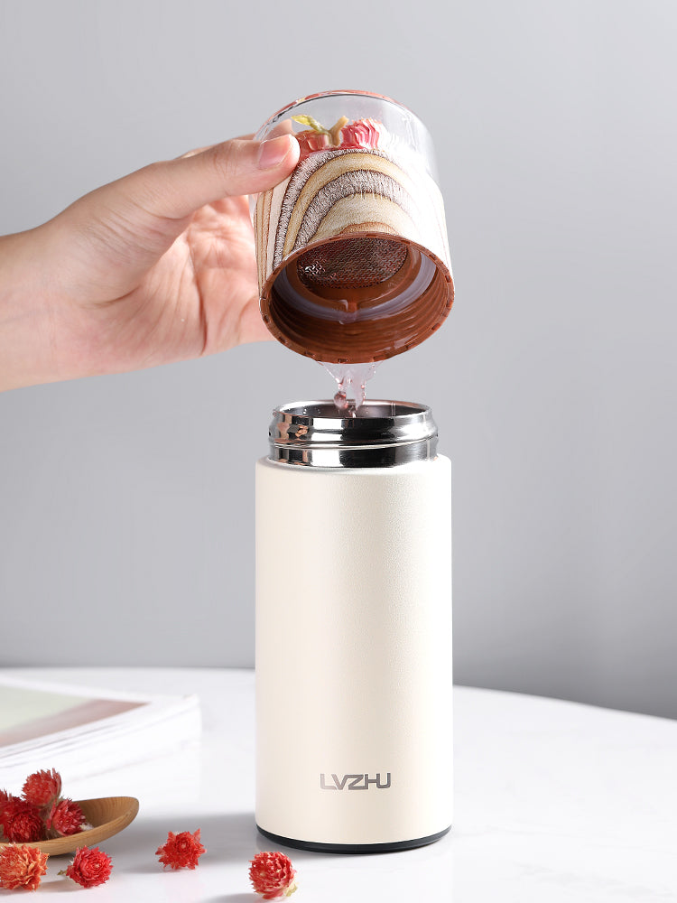 Pink stainless steel Thermos water bottle with tea infuser, 360ml travel mug by WoodyKitchenware, perfect for tea on the go.