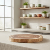 Round double-sided log cutting board by WoodyKitchenware featuring natural wood grain and versatile design for food prep and serving.